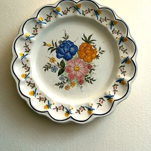 Decorative hand painted ceramic plate from artisan. Usable flat or can be hung